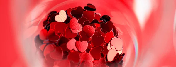 Røde hjerter er spredt i et glas. Valentinsdag koncept. - Stock-foto