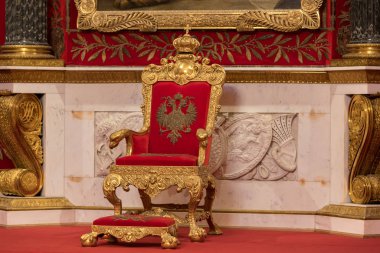 Saint Petersburg, Russia  August 2018: Close-up of golden throne of Tsar, throne room, Peter the Great Memorial Hall, Hermitage Museum, Winter Palace, St Petersburg