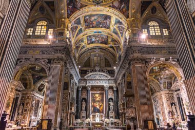 Genova, Genoa, Italy - January 2019: Sumptuous marble interior with frescoed ceilings of baroque church Chiesa dei Santi Ambrogio e Andrea known as Chiesa del Ges, Piazza Matteotti