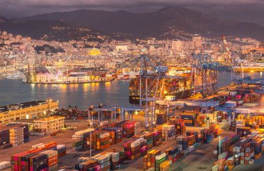 Genova, Genoa, Italy - January 2019: Aerial view of shipping and container terminal, stacked containers and loading dock side cranes in the port of Genoa, Magazzini del cotone and Porto Antico, sea