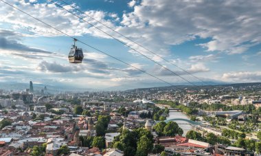 Tbilisi, Georgia: Aerial panoramic view from Narikala Fortress, aerial cable car, old town, modern architecture (Bridge of Peace, Fuksas music theatre exhibition hall), Kura river, Rike Park