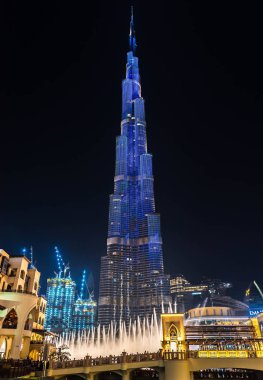 Dubai, UAE, United Arab Emirates - August 2019: Amazing futuristic light show on the Burj Khalifa, the tallest building skyscraper in the world, illuminated by night