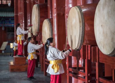 Beijing, China - January 2018: Performance at the Drum Tower in Beijing: performers play beat drums, drum exhibition