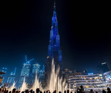 Dubai, UAE, United Arab Emirates - August 2019: Amazing futuristic light show on the Burj Khalifa, the tallest building skyscraper in the world, illuminated by night