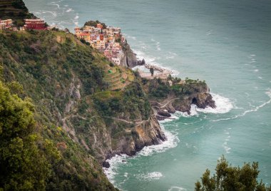 Manarola, Cinque Terre (Five Lands), Liguria, Italy: Beautiful aerial view of a village perched on a hill, typical colorful houses. The Cinque Terre National Park is a UNESCO World Heritage Site
