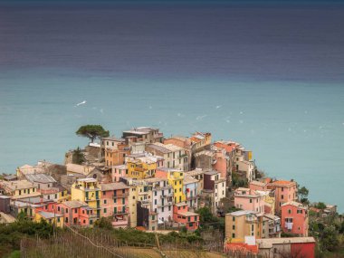 Corniglia, Cinque Terre (Five Lands), Liguria, Italy: Beautiful aerial view of a village perched on a hill, typical colorful houses. The Cinque Terre National Park is a UNESCO World Heritage Site.