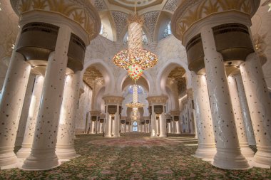 Abu Dhabi, United Arab Emirates, UAE - November 2019: Interior (prayer hall) of Sheikh Zayed Mosque, Grand Mosque with columns, arches and glass chandeliers.