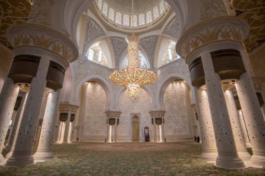 Abu Dhabi, United Arab Emirates, UAE - November 2019: Interior (prayer hall) of Sheikh Zayed Mosque, Grand Mosque with columns, arches and glass chandeliers.