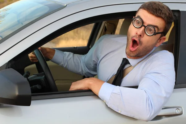 Funny Geek Wondering Driving Car Royalty Free Stock Images
