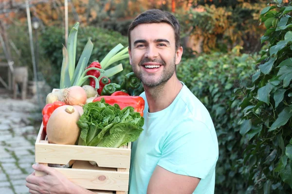 Young man holding vegan groceries