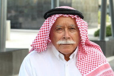 Outdoor portrait of traditional Arab elder man  clipart