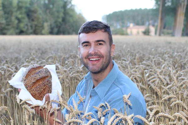 Handsome Farmer Holding Fresh Bread Field — Stock Photo, Image