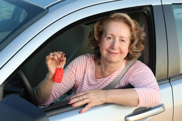 happy woman with keys of car
