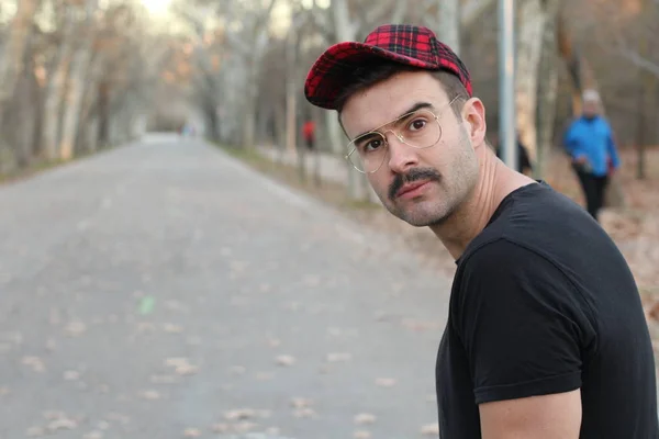 Young Man Mustache Wearing Eyeglasses Checkered Cap Autumnal Park — 스톡 사진