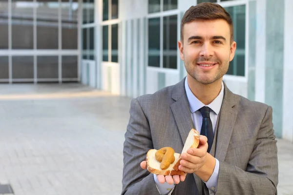 Close Retrato Bonito Jovem Empresário Segurando Sanduíche Com Poop Dentro — Fotografia de Stock