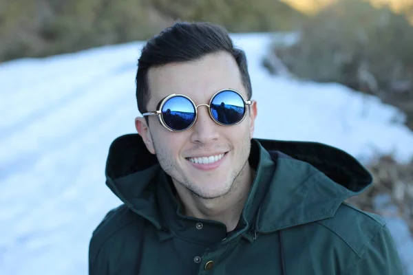 Stylish Man Green Coat Sunglasses Posing Blurred Winter Background — Stock Photo, Image