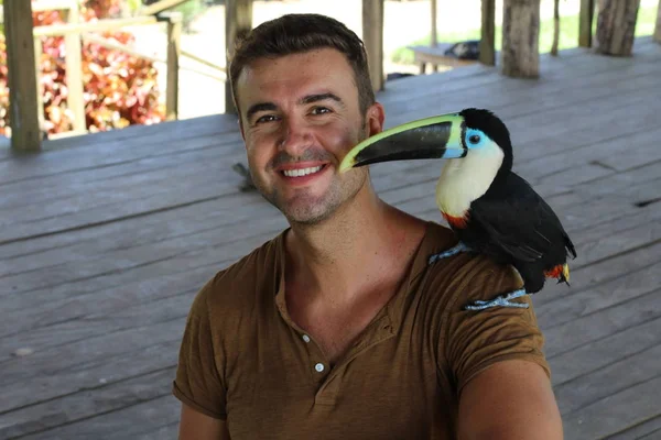 Man Holding Colorful Toucan Bird — 스톡 사진