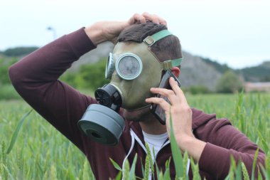 Man with gas mask calling from nature clipart