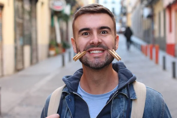 Close Portrait Handsome Young Man Clothespins Face Grimacing Street — Stock Photo, Image