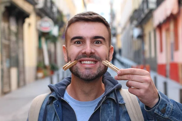 Close Portrait Handsome Young Man Clothespins Face Grimacing Street — Stock Photo, Image