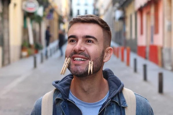 Close Portrait Handsome Young Man Clothespins Face Grimacing Street — Stock Photo, Image