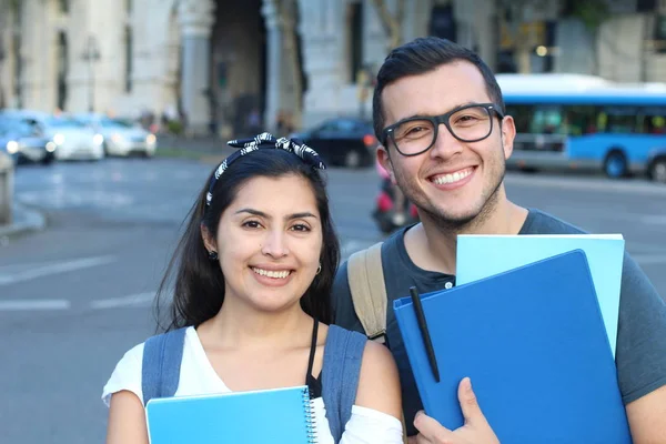 Ecstatic couple of ethnic international students abroad