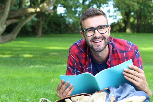 Close Portrait Handsome Young Man Studying Notebook While Lying Grass — Stock Photo, Image