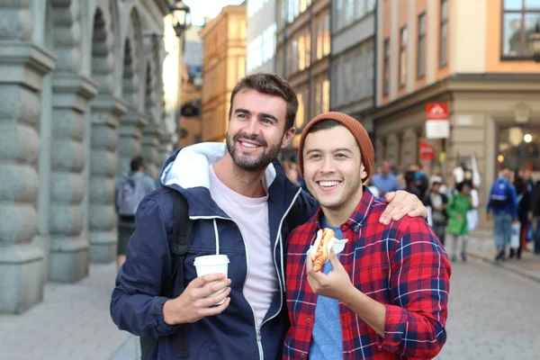 Beautiful homosexual couple strolling the city streets