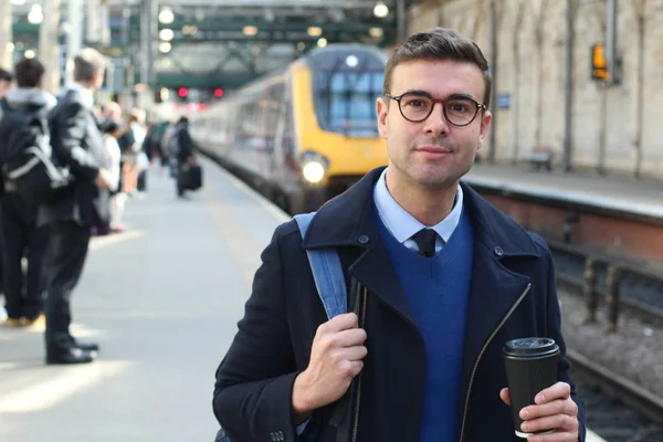 Businessman walking in retro train station