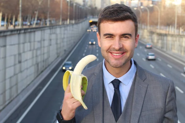 Empresário Sorridente Engraçado Segurando Uma Banana — Fotografia de Stock