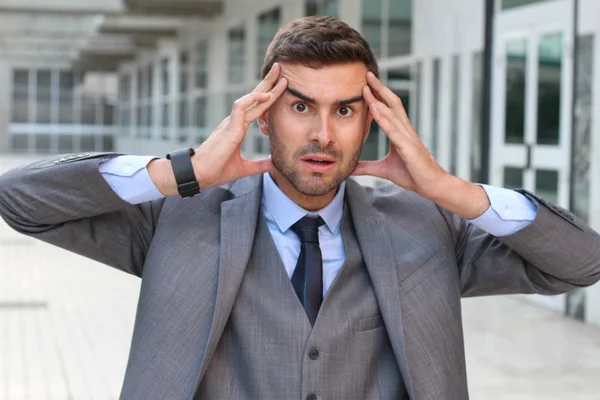 Businessman showing fear and stress close up