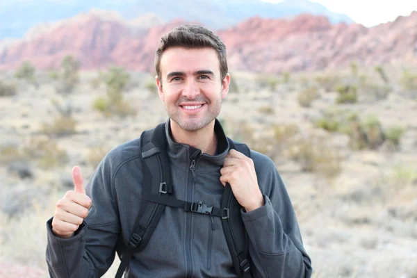 Smiling Man Backpack Posing Showing Thumb Natural Background — 스톡 사진