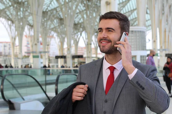 Businessman calling by phone at the airport