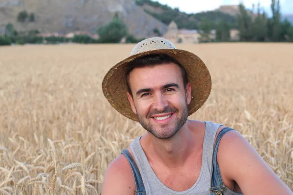 close-up portrait of handsome young farmer on nature