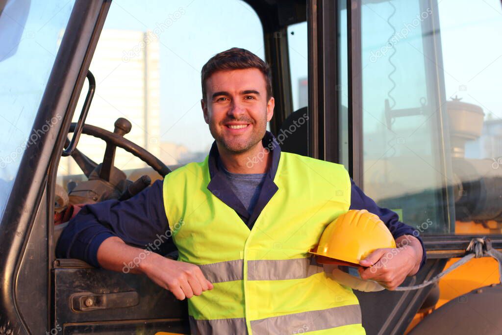 Professional construction industry driver, closeup portrait at sunset time 