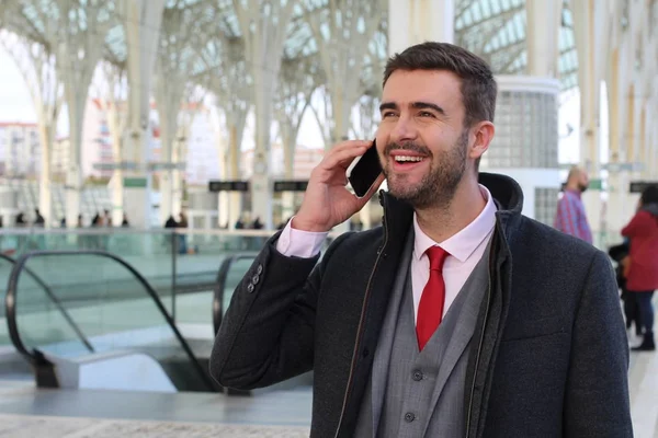 Businessman calling by phone at the airport
