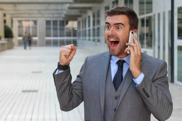 Empresário Ouvindo Telefone Com Entusiasmo — Fotografia de Stock