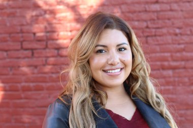 Portrait of a young Hispanic female smiling 