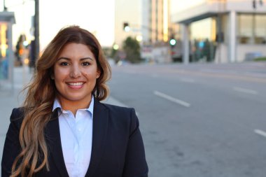 Beautiful smiley confident businesswoman portrait outside