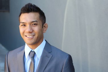 Portrait of a confident Asian lawyer outside
