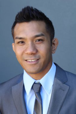 Portrait of a confident Asian lawyer outside