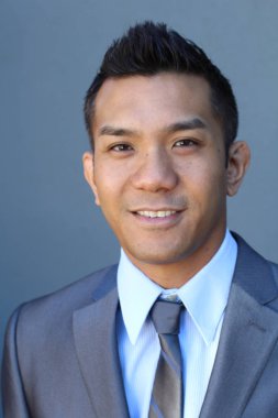 Portrait of a confident Asian lawyer outside