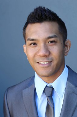 Portrait of a confident Asian lawyer outside