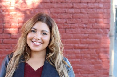 Portrait of a young Hispanic female smiling 