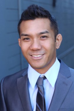 Portrait of a confident Asian lawyer outside