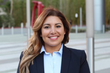 Beautiful smiley confident businesswoman portrait outside