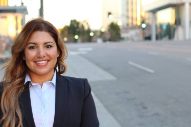Beautiful smiley confident businesswoman portrait outside