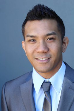 Portrait of a confident Asian lawyer outside