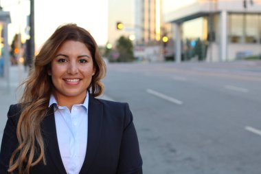 Beautiful smiley confident businesswoman portrait outside