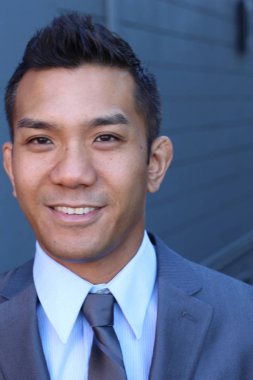 Portrait of a confident Asian lawyer outside